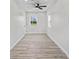 Bedroom with ample natural light from a large window, and modern ceiling fan at 1409 S Kiel Ave, Indianapolis, IN 46241