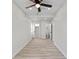 Spacious bedroom with ample natural light, modern ceiling fan, and private bath at 1409 S Kiel Ave, Indianapolis, IN 46241