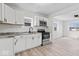 Modern kitchen features stainless steel appliances, sleek countertops, and ample cabinet space at 1409 S Kiel Ave, Indianapolis, IN 46241