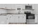 Modern kitchen features stainless steel appliances, sleek countertops, and ample cabinet space at 1409 S Kiel Ave, Indianapolis, IN 46241