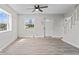 Bright living room featuring sleek, light-colored floors, and large windows at 1409 S Kiel Ave, Indianapolis, IN 46241