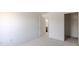 A bright bedroom with carpet flooring, neutral walls and door leading to the hallway and closet at 14117 Princewood Dr, Fishers, IN 46037