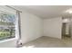 A bright bedroom with carpet flooring, neutral walls and window overlooking a leafy landscape at 14117 Princewood Dr, Fishers, IN 46037