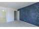 A bedroom features a unique navy blue wall with a constellation design and a hallway with white doors at 14117 Princewood Dr, Fishers, IN 46037