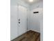 Bright entryway featuring a white door and wood floors, offering a clean and modern welcome at 14117 Princewood Dr, Fishers, IN 46037