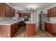 Spacious kitchen has an island, stainless steel appliances, and quartz countertops at 14117 Princewood Dr, Fishers, IN 46037