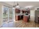 Open kitchen and dining area with stainless appliances and backyard access at 14117 Princewood Dr, Fishers, IN 46037