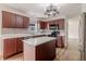 Updated kitchen boasts a center island, stainless appliances, and modern finishes at 14117 Princewood Dr, Fishers, IN 46037