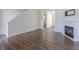 Bright living room showcasing hardwood floors, a fireplace, and an open layout, ideal for modern living at 14117 Princewood Dr, Fishers, IN 46037