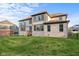 Spacious backyard with a well-manicured lawn and brick home, ideal for outdoor activities and entertaining at 14872 Autumn View Way, Fishers, IN 46037
