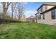 Large backyard with expansive lawn, iron fencing, and surrounding homes at 14872 Autumn View Way, Fishers, IN 46037