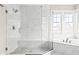 Modern marble bathroom featuring a glass enclosed shower and soaking tub at 14872 Autumn View Way, Fishers, IN 46037
