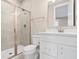 Well-lit bathroom with glass-enclosed shower, bright white vanity and tile floor at 14872 Autumn View Way, Fishers, IN 46037