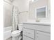 Clean bathroom featuring tile flooring, a toilet, and a shower with white vanity at 14872 Autumn View Way, Fishers, IN 46037