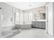Luxurious marble bathroom with a glass-enclosed shower, soaking tub, and elegant fixtures at 14872 Autumn View Way, Fishers, IN 46037