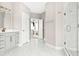 Spacious bathroom featuring marble floors, a glass shower, and dual vanities at 14872 Autumn View Way, Fishers, IN 46037