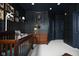Stylish Bedroom with dark walls, a crib, and charming decor at 14872 Autumn View Way, Fishers, IN 46037