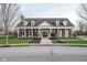 Classic brick clubhouse featuring prominent columns, arched windows, and manicured landscaping at 14872 Autumn View Way, Fishers, IN 46037