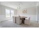 Formal dining room featuring an oval table, six chairs, and elegant chandelier at 14872 Autumn View Way, Fishers, IN 46037