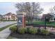 Elegant community entrance sign with brick pillar and iron gate landscaping at 14872 Autumn View Way, Fishers, IN 46037