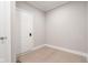 Clean entryway with a white door and light hardwood floors at 14872 Autumn View Way, Fishers, IN 46037