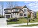 Charming home with a stone and brick exterior, complete with a curved driveway and manicured front yard at 14872 Autumn View Way, Fishers, IN 46037