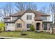 Beautiful two-story home showcasing a mix of brick and stone exterior with a well-manicured lawn at 14872 Autumn View Way, Fishers, IN 46037