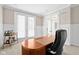 Bright home office with wainscoting, a unique desk, and a rolling bar cart at 14872 Autumn View Way, Fishers, IN 46037