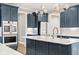 A modern kitchen featuring a center island, stainless steel appliances, and beautiful cabinetry at 14872 Autumn View Way, Fishers, IN 46037