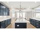Open kitchen with a center island, modern appliances, and an open floor plan leading to the dining area at 14872 Autumn View Way, Fishers, IN 46037