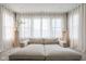 Living room featuring a large window dressed with sheer curtains and stylish neutral decor at 14872 Autumn View Way, Fishers, IN 46037