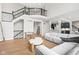 Spacious living room with high ceilings, a staircase, and an open view to the kitchen area at 14872 Autumn View Way, Fishers, IN 46037