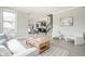 Open-concept living room with view into kitchen and adjacent staircase at 14872 Autumn View Way, Fishers, IN 46037