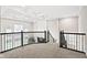 Open and airy loft space with decorative ceiling, wrought iron railing and windows at 14872 Autumn View Way, Fishers, IN 46037