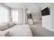 Bright main bedroom offers a serene space with a seating area and a flat screen television at 14872 Autumn View Way, Fishers, IN 46037