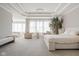 Expansive main bedroom suite with sitting area, tray ceiling, and serene lighting at 14872 Autumn View Way, Fishers, IN 46037