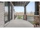 Inviting outdoor porch area with stone pillars and black railings, offering a relaxing space at 14872 Autumn View Way, Fishers, IN 46037