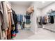 Organized walk-in closet with ample storage and shelving for clothing and accessories at 14872 Autumn View Way, Fishers, IN 46037