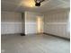 Spacious unfinished two-car garage, ready for customization and storage at 5125 Gerhing Dr, Indianapolis, IN 46239