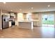 Open concept kitchen with an island, modern appliances, and abundant natural light at 5125 Gerhing Dr, Indianapolis, IN 46239