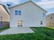 Home exterior displaying a back patio and a large grassy lawn perfect for outdoor activities and relaxation at 15507 Dry Creek Rd, Noblesville, IN 46060