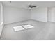 Spacious living room featuring neutral walls, carpet flooring and ceiling fan for comfortable living at 15507 Dry Creek Rd, Noblesville, IN 46060
