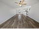 Bright, open-concept living room features wood floors and a ceiling fan at 15507 Dry Creek Rd, Noblesville, IN 46060
