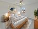 Cozy bedroom with a comfortable bed, soft lighting, a ceiling fan, and a serene atmosphere at 15507 Dry Creek Rd, Noblesville, IN 46060
