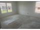 A bright, unfinished bedroom with two large windows, providing a clear view of the outdoors at 1656 Winn Ct, Fortville, IN 46040