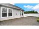 Exterior view of backyard with gray siding, double-hung windows, and white vinyl fencing at 16870 Imperial Ct, Fishers, IN 46040