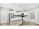 Bright kitchen with white cabinetry, stainless appliances, and an island for seating at 16870 Imperial Ct, Fishers, IN 46040