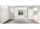 Bright, open living room with sliding glass doors and neutral carpeting at 16870 Imperial Ct, Fishers, IN 46040