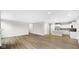 Open-concept living room with wood floors flowing into the kitchen, perfect for entertaining at 16870 Imperial Ct, Fishers, IN 46040