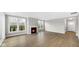 Bright living room with a fireplace, large windows, and wood flooring at 16870 Imperial Ct, Fishers, IN 46040